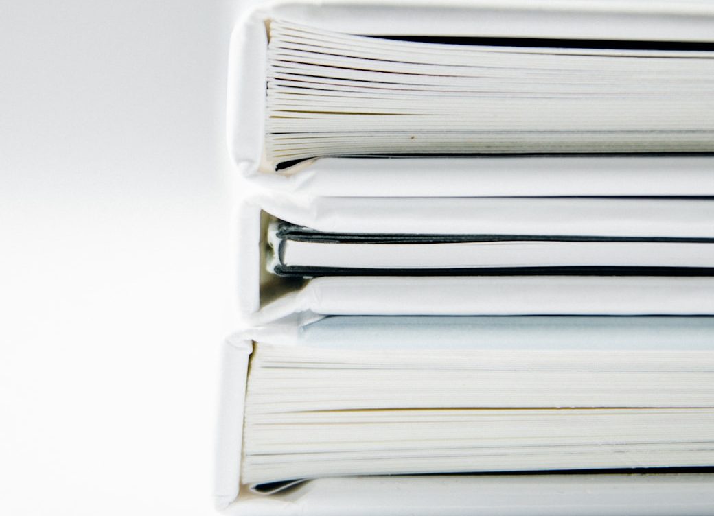 A stack of bound business dossiers